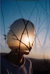 Silhouetted person looking out over nature